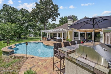 Discover your dream home in the exclusive Queens Harbour Yacht & on Queens Harbour Yacht and Country Club in Florida - for sale on GolfHomes.com, golf home, golf lot