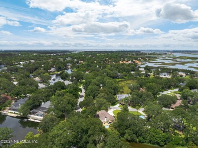 Discover your dream home in the exclusive Queens Harbour Yacht & on Queens Harbour Yacht and Country Club in Florida - for sale on GolfHomes.com, golf home, golf lot