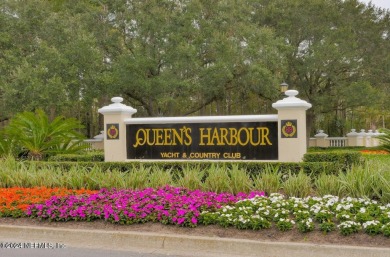 Discover your dream home in the exclusive Queens Harbour Yacht & on Queens Harbour Yacht and Country Club in Florida - for sale on GolfHomes.com, golf home, golf lot