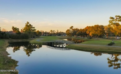 Discover your dream home in the exclusive Queens Harbour Yacht & on Queens Harbour Yacht and Country Club in Florida - for sale on GolfHomes.com, golf home, golf lot