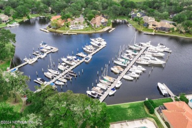 Discover your dream home in the exclusive Queens Harbour Yacht & on Queens Harbour Yacht and Country Club in Florida - for sale on GolfHomes.com, golf home, golf lot