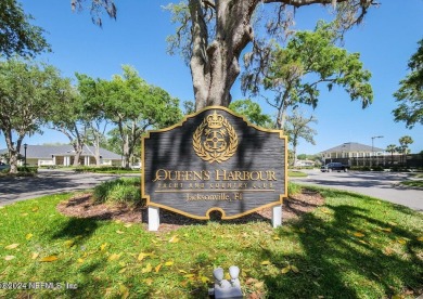 Discover your dream home in the exclusive Queens Harbour Yacht & on Queens Harbour Yacht and Country Club in Florida - for sale on GolfHomes.com, golf home, golf lot