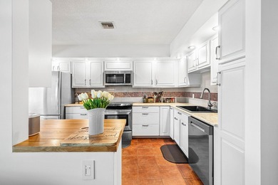 Enjoy stunning lake and golf course vistas from this on Quail Ridge Golf Course and Country Club in Florida - for sale on GolfHomes.com, golf home, golf lot