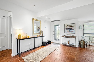 Enjoy stunning lake and golf course vistas from this on Quail Ridge Golf Course and Country Club in Florida - for sale on GolfHomes.com, golf home, golf lot