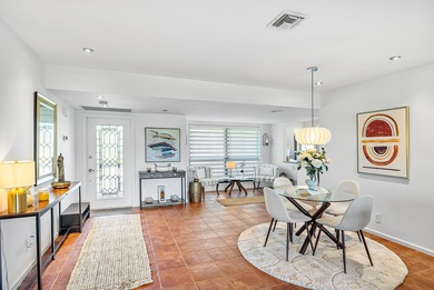 Enjoy stunning lake and golf course vistas from this on Quail Ridge Golf Course and Country Club in Florida - for sale on GolfHomes.com, golf home, golf lot