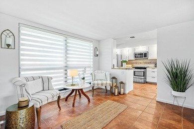 Enjoy stunning lake and golf course vistas from this on Quail Ridge Golf Course and Country Club in Florida - for sale on GolfHomes.com, golf home, golf lot