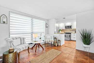 Enjoy stunning lake and golf course vistas from this on Quail Ridge Golf Course and Country Club in Florida - for sale on GolfHomes.com, golf home, golf lot