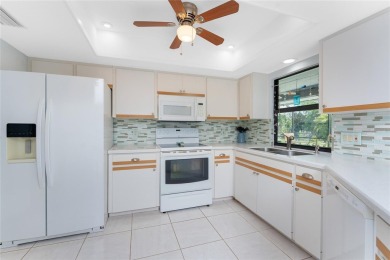 Under contract-accepting backup offers. Charming curb appeal on Pinemoor West Golf Club in Florida - for sale on GolfHomes.com, golf home, golf lot
