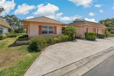 This villa has the BEST Lanai  because it's located half way on Seminole Lake Country Club in Florida - for sale on GolfHomes.com, golf home, golf lot