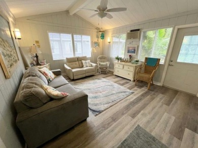 This beautifully updated 2bd, 2ba home is situated on a private on Del Tura Golf and Country Club in Florida - for sale on GolfHomes.com, golf home, golf lot