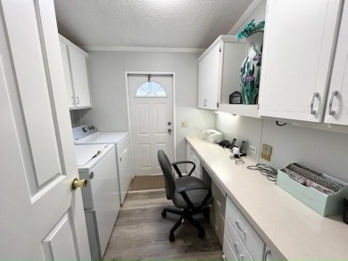 This beautifully updated 2bd, 2ba home is situated on a private on Del Tura Golf and Country Club in Florida - for sale on GolfHomes.com, golf home, golf lot
