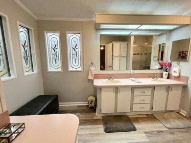 This beautifully updated 2bd, 2ba home is situated on a private on Del Tura Golf and Country Club in Florida - for sale on GolfHomes.com, golf home, golf lot