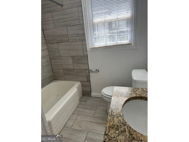 East Atlanta Deal:  This four side brick single family house was on East Lake Golf Club in Georgia - for sale on GolfHomes.com, golf home, golf lot