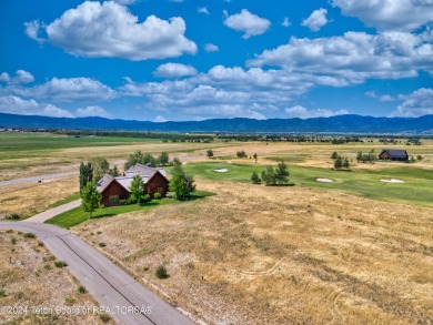 Stunning custom home site overlooking Hole 7 of the Hale Irwin on Teton Reserve in Idaho - for sale on GolfHomes.com, golf home, golf lot