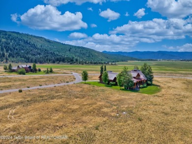 Stunning custom home site overlooking Hole 7 of the Hale Irwin on Teton Reserve in Idaho - for sale on GolfHomes.com, golf home, golf lot