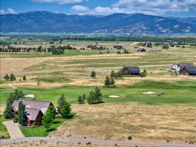 Stunning custom home site overlooking Hole 7 of the Hale Irwin on Teton Reserve in Idaho - for sale on GolfHomes.com, golf home, golf lot