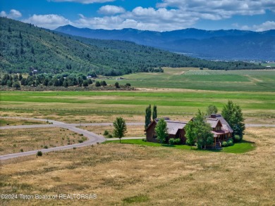 Stunning custom home site overlooking Hole 7 of the Hale Irwin on Teton Reserve in Idaho - for sale on GolfHomes.com, golf home, golf lot