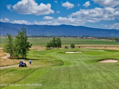 Stunning custom home site overlooking Hole 7 of the Hale Irwin on Teton Reserve in Idaho - for sale on GolfHomes.com, golf home, golf lot