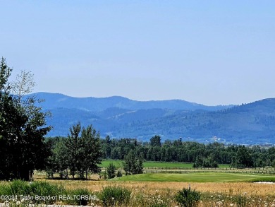 Stunning custom home site overlooking Hole 7 of the Hale Irwin on Teton Reserve in Idaho - for sale on GolfHomes.com, golf home, golf lot