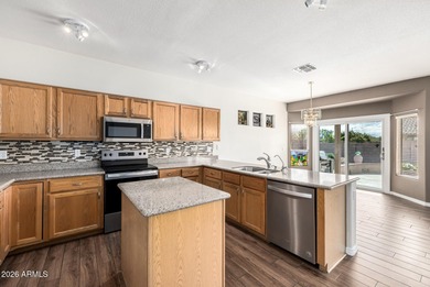 Spacious, open floor plan with kitchen and family room open to on Springfield Golf Resort in Arizona - for sale on GolfHomes.com, golf home, golf lot