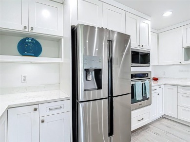 RECENT REFRESH!  NEW PAINT, NEW FLOORS & MORE!! MOVE IN READY on Pasadena Yacht and Country Club in Florida - for sale on GolfHomes.com, golf home, golf lot