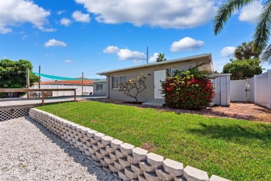 Embrace the Florida lifestyle in Dana Shores, where waterfront on Rocky Point Golf Course in Florida - for sale on GolfHomes.com, golf home, golf lot