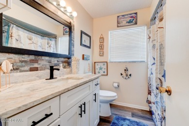 Step inside this beautifully updated 3-bedroom, 2-bath, 2-car on The Club At Pelican Bay - North Course in Florida - for sale on GolfHomes.com, golf home, golf lot