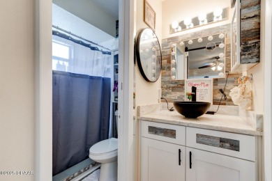 Step inside this beautifully updated 3-bedroom, 2-bath, 2-car on The Club At Pelican Bay - North Course in Florida - for sale on GolfHomes.com, golf home, golf lot