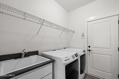 Experience the coveted Dataw Island lifestyle in this immaculate on Dataw Island Club in South Carolina - for sale on GolfHomes.com, golf home, golf lot