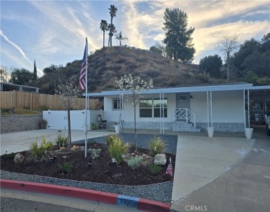 Location, location, location! This adorable turnkey gem is on Canyon Lake Country Club in California - for sale on GolfHomes.com, golf home, golf lot
