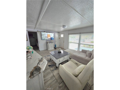 Location, location, location! This adorable turnkey gem is on Canyon Lake Country Club in California - for sale on GolfHomes.com, golf home, golf lot