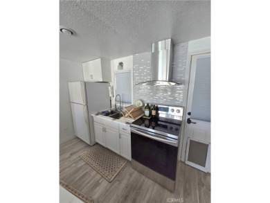 Location, location, location! This adorable turnkey gem is on Canyon Lake Country Club in California - for sale on GolfHomes.com, golf home, golf lot
