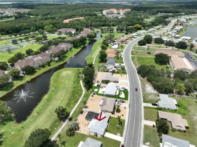 Neat POOL HOME (salt water) with a waterfall overlooking Freedom on North Lakes Golf Course in Florida - for sale on GolfHomes.com, golf home, golf lot