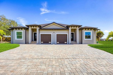 Welcome to a beautifully crafted, newer-construction duplex on Rotonda Golf and Country Club The Palms Course in Florida - for sale on GolfHomes.com, golf home, golf lot