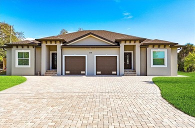 Welcome to a beautifully crafted, newer-construction duplex on Rotonda Golf and Country Club The Palms Course in Florida - for sale on GolfHomes.com, golf home, golf lot