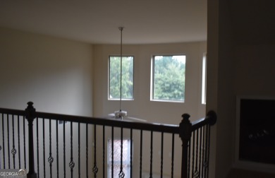 A stunning 4-sided brick ranch home perfectly situated within on Crystal Lake Golf and Country Club in Georgia - for sale on GolfHomes.com, golf home, golf lot