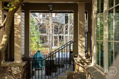 Lakefront retreat - 127 ft waterfront - Max dock with lift - on Reynolds Lake Oconee - The Oconee in Georgia - for sale on GolfHomes.com, golf home, golf lot