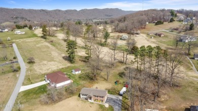 This gorgeous 5 bedroom, 3 full bath split level home has been on La Follette Country Club in Tennessee - for sale on GolfHomes.com, golf home, golf lot