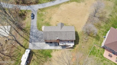 This gorgeous 5 bedroom, 3 full bath split level home has been on La Follette Country Club in Tennessee - for sale on GolfHomes.com, golf home, golf lot