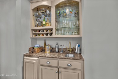 Gorgeous pond front custom home with golf course views on Carolina National Golf Club in North Carolina - for sale on GolfHomes.com, golf home, golf lot