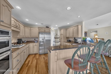 Gorgeous pond front custom home with golf course views on Carolina National Golf Club in North Carolina - for sale on GolfHomes.com, golf home, golf lot