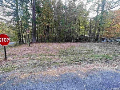 Call this 3 bd/2ba home in the evolving Diamond Head yours! on Diamondhead Golf and Country Club in Arkansas - for sale on GolfHomes.com, golf home, golf lot