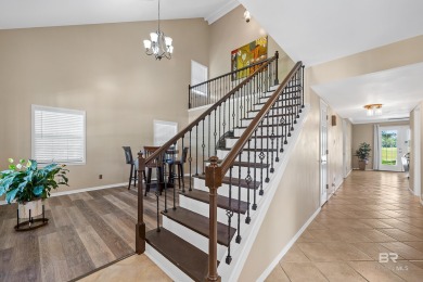 Located in Wedgewood Estates, this Gulf Shores retreat with a on The Golf Club of the Wharf in Alabama - for sale on GolfHomes.com, golf home, golf lot