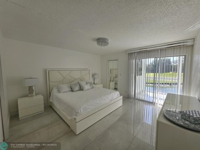 STUNNINGLY REMODELED 2BR/2BA CONDO, REIMAGINED WITH NO EXPENSE on Wynmoor Golf Course in Florida - for sale on GolfHomes.com, golf home, golf lot