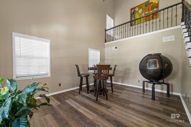 Located in Wedgewood Estates, this Gulf Shores retreat with a on The Golf Club of the Wharf in Alabama - for sale on GolfHomes.com, golf home, golf lot