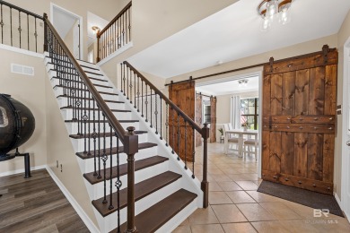 Located in Wedgewood Estates, this Gulf Shores retreat with a on The Golf Club of the Wharf in Alabama - for sale on GolfHomes.com, golf home, golf lot