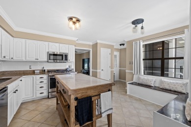 Located in Wedgewood Estates, this Gulf Shores retreat with a on The Golf Club of the Wharf in Alabama - for sale on GolfHomes.com, golf home, golf lot