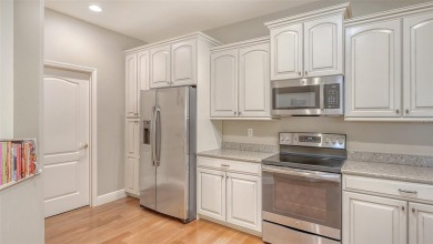 RARELY AVAILABLE END UNIT WITH UNOBSTRUCTED, PEACEFUL AND on Legacy Golf Club in Florida - for sale on GolfHomes.com, golf home, golf lot
