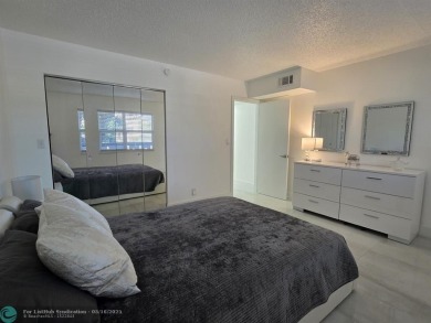 STUNNINGLY REMODELED 2BR/2BA CONDO, REIMAGINED WITH NO EXPENSE on Wynmoor Golf Course in Florida - for sale on GolfHomes.com, golf home, golf lot