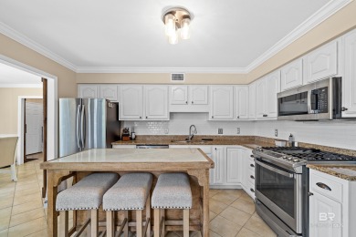 Located in Wedgewood Estates, this Gulf Shores retreat with a on The Golf Club of the Wharf in Alabama - for sale on GolfHomes.com, golf home, golf lot